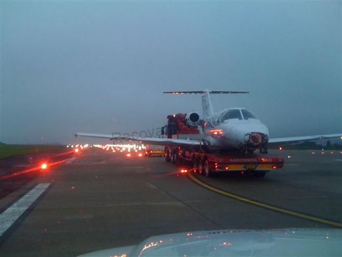 plane-on-back-of-recovery-truck