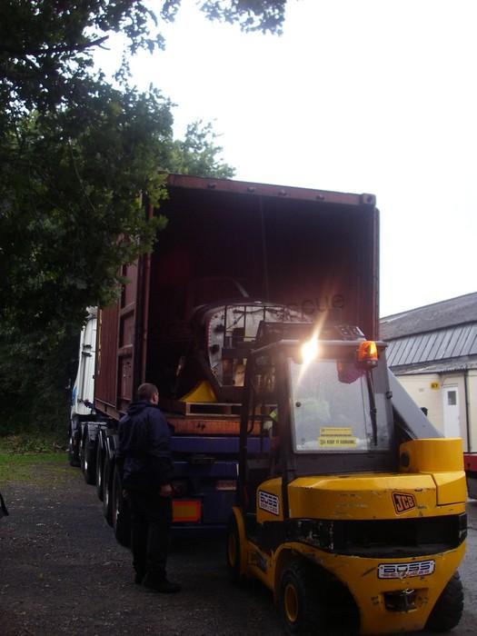 forklift lifting plane into lorry